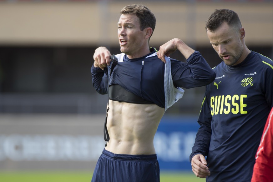 epa07905306 Switzerland&#039;s national soccer team player Stephan Lichtsteiner, left, and Haris Seferovic, right, during a training session before the upcoming UEFA Euro 2020 qualifying soccer matchs ...