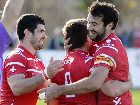 From left: Ludovic Pommies Benjamin Doy and Jonathan Wullschleger celebrate a point during the rugby match for the European Nations Cup 2014-2016, division 2A, Switzerland against Israel at the stadiu ...