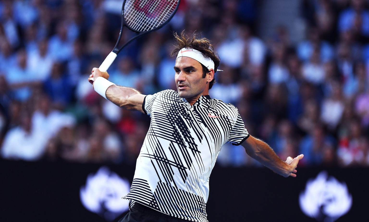 epa05746052 Roger Federer of Switzerland in action during his Men&#039;s Singles quarter-final match against Mischa Zverev of Germany at the Australian Open Grand Slam tennis tournament in Melbourne,  ...
