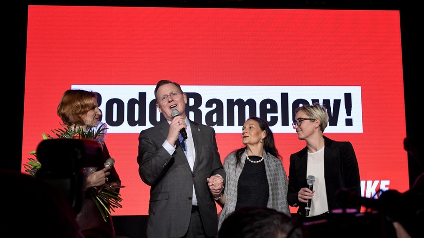 epa07954803 (L-R) Co-chairwoman of German The Left (Die Linke) party Katja Kipping, Prime Minister of Thuringia and top candidate of The Left (Die Linke) party for the state elections Bodo Ramelow and ...