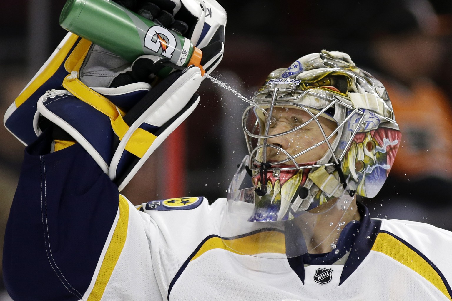 FILE - In this Feb. 21, 2015, file photo, Nashville Predators&#039; Pekka Rinne, of Finland, squirts himself with water before the second period of an NHL hockey game against the Philadelphia Flyers i ...