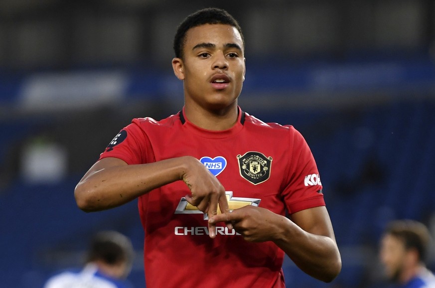 FILE - In this Tuesday, June 30, 2020 file photo, Manchester United&#039;s Mason Greenwood celebrates after scoring the opening goal of his team during the English Premier League soccer match between  ...
