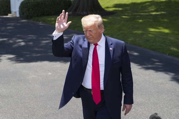 President Donald Trump waves as he departs after speaking with reporters on the South Lawn of the White House, Wednesday, June 26, 2019, in Washington. Trump is en route to Japan for the G-20 summit.  ...