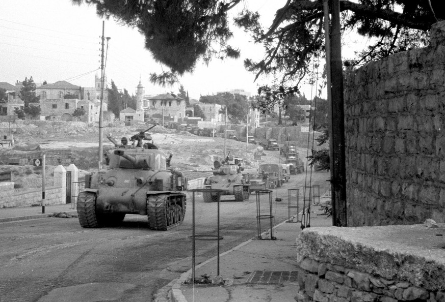 In this image released by Israel&#039;s Defense Ministry Monday, June 4, 2007, Israeli tanks move into Jerusalem&#039;s Old City during the Six Day War, in June 1967. Four decades after an underdog Is ...
