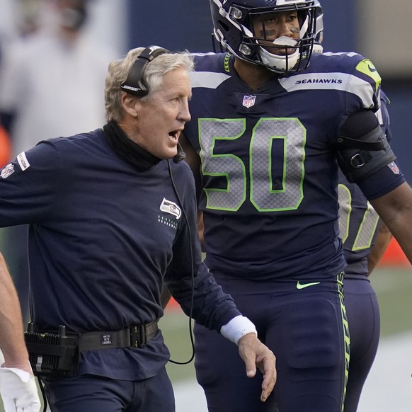 Seattle Seahawks head coach Pete Carroll celebrates with outside linebacker K.J. Wright (50) after wide receiver DK Metcalf scored a touchdown against the New England Patriots during the first half of ...