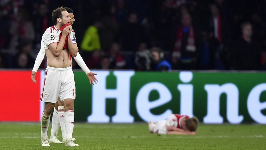 Ajax players react at the end of the Champions League semifinal second leg soccer match between Ajax and Tottenham Hotspur at the Johan Cruyff ArenA in Amsterdam, Netherlands, Wednesday, May 8, 2019.  ...