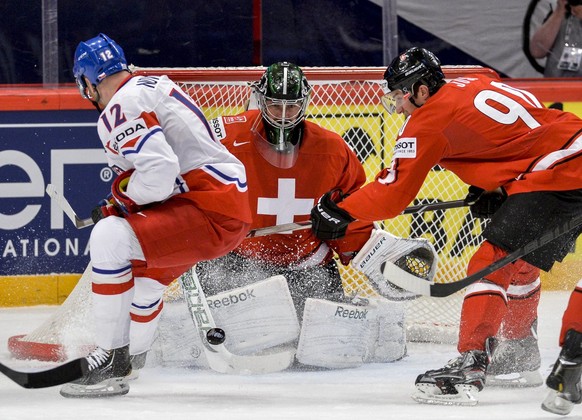 Swiss goalie Martin Gerber watches the puck during the Ice Hockey World Championship quarterfinal match against Czech Republic in Stockholm, Sweden, Thursday May 16, 2013. (AP Photo/Anders Wiklund) SW ...