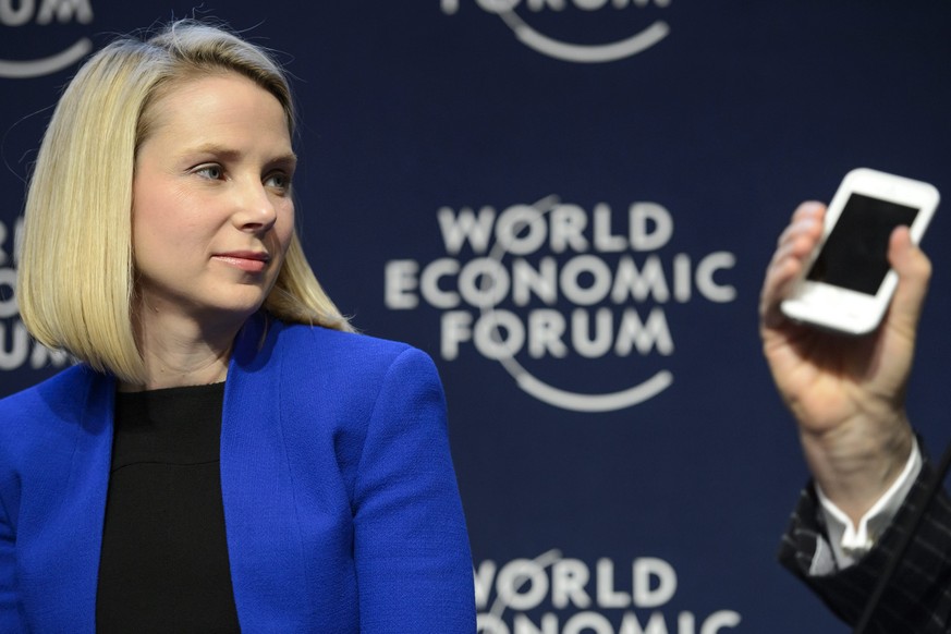 epa05440185 (FILE) A file picture dated 22 January 2014 shows Yahoo CEO Marissa Mayer (L) during a panel session on the first day of the 44th Annual Meeting of the World Economic Forum (WEF) in Davos, ...