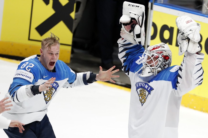 Finland&#039;s Harri Pesonen (82) celebrates with goaltender Kevin Lankinen after Finland beat Canada 3-1 in the Ice Hockey World Championships gold medal match at the Ondrej Nepela Arena in Bratislav ...