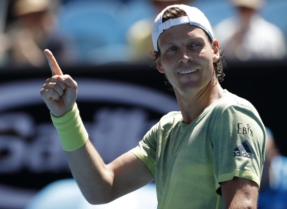 Tomas Berdych of the Czech Republic reacts after defeating Italy&#039;s Fabio Fognini during their fourth round match at the Australian Open tennis championships in Melbourne, Australia, Monday, Jan.  ...