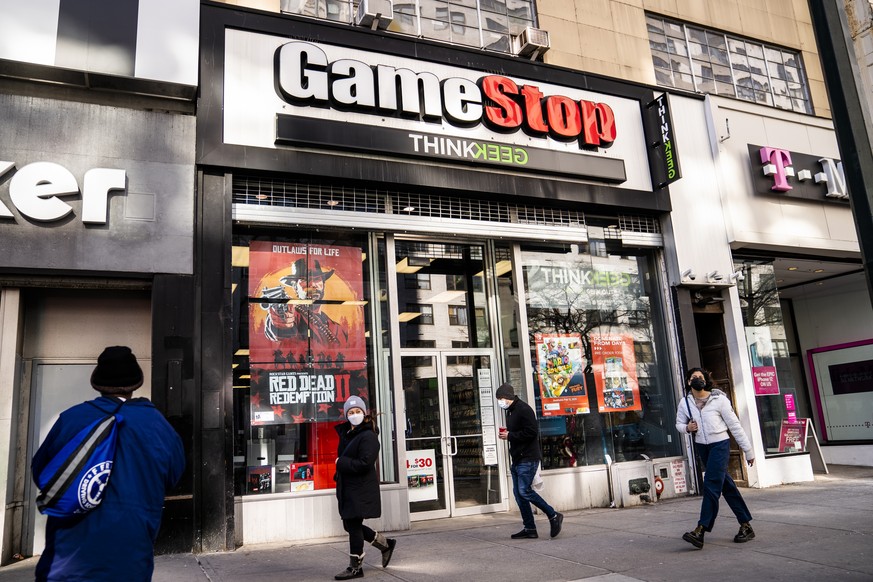 FILE - Pedestrians pass a GameStop store on 14th Street at Union Square, Thursday, Jan. 28, 2021, in the Manhattan borough of New York. GameStop and a handful of other stocks whose meteoric rise last  ...