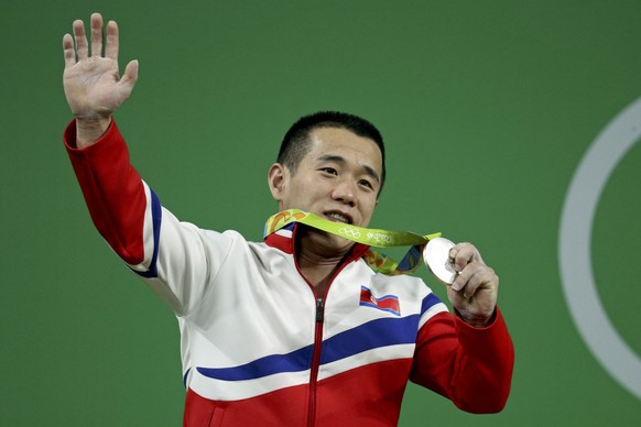2016 Rio Olympics - Weightlifting - Final - Men&#039;s 56kg - Riocentro - Pavilion 2 - Rio de Janeiro, Brazil - 07/08/2016. Om Yun Chol (PRK) of North Korea poses with his medal. REUTERS/Stoyan Nenov  ...