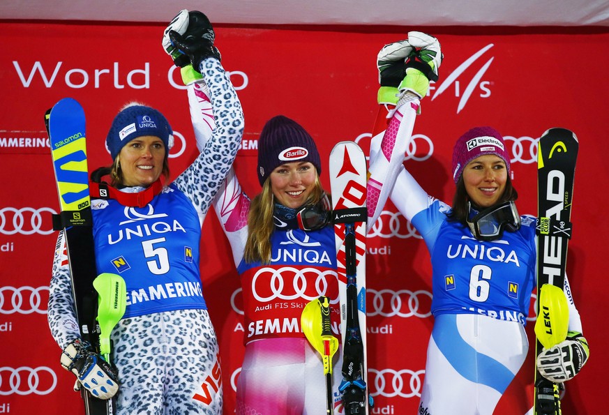 From left, Slovakia&#039;s Veronika Velez Zuzulova, second placed, the winner Mikaela Shiffrin, of the United States, and third placed Wendy Holdener, of Switzerland, celebrate on podium after an alpi ...