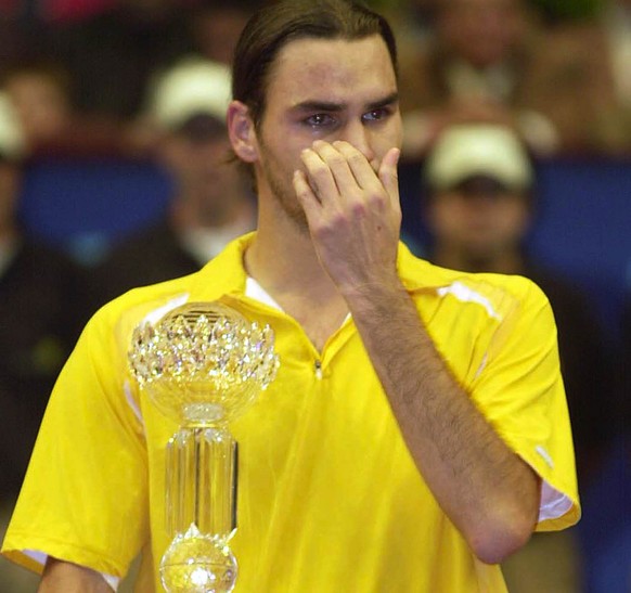 Roger Federer from Switzerland, winner of the ATP tennis tournament in Vienna, wipes his tears in an emotional moment, on Sunday, Oct. 13, 2002. After receiving his trophy Federer remembered in a spee ...