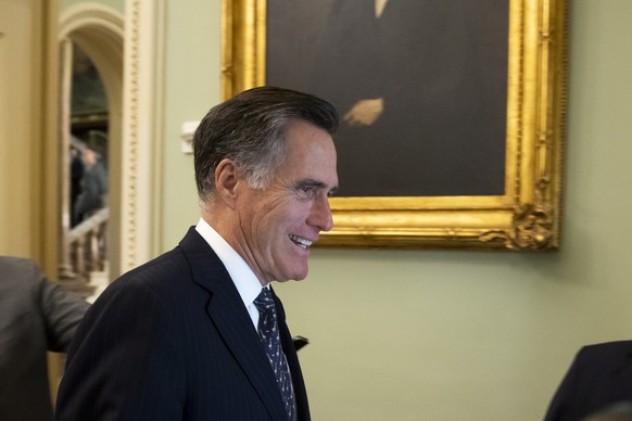 epa08160511 Republican Senator from Utah Mitt Romney walks near the Senate chamber before the Senate impeachment trial in the US Capitol in Washington, DC, USA, 24 January 2020. The House impeachment  ...