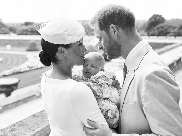 This is an official christening photo released by the Duke and Duchess of Sussex on Saturday, July 6, 2019, showing Britain&#039;s Prince Harry, right and Meghan, the Duchess of Sussex with their son  ...
