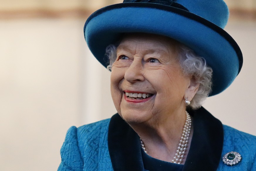 Britain&#039;s Queen Elizabeth II visits the new headquarters of the Royal Philatelic society in London Tuesday Nov. 26, 2019. The Royal Philatelic society holds an archive of documents covering every ...