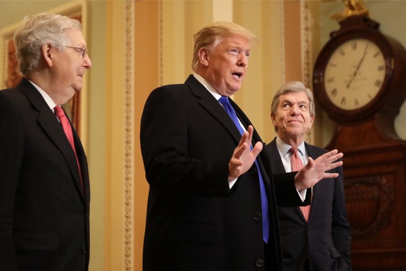 epa07465264 US President Donald J. Trump (C), along with Republican Senate Majority Leader Mitch McConnell (L) and Republican Senator from Missouri Roy Blunt (R), speaks to reporters as he arrives to  ...