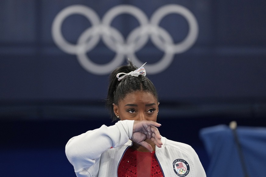 Simone Biles, of the United States, watches gymnasts perform at the 2020 Summer Olympics, Tuesday, July 27, 2021, in Tokyo. Biles says she wasn&#039;t in right &#039;headspace&#039; to compete and wit ...