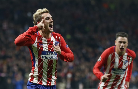 Atletico&#039;s Antoine Griezmann celebrates scoring the opening goal during a Champions League group C soccer match between Atletico Madrid and Roma at the Wanda Metropolitano stadium in Madrid, Wedn ...