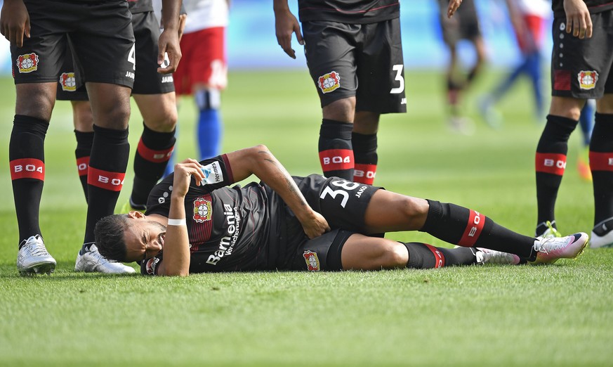 Leverkusen&#039;s Karim Bellarabi is injured and has to be replaced during the German Bundesliga soccer match between Bayer Leverkusen and Hamburger SV in Leverkusen, Germany, Saturday, Sept. 10, 2016 ...