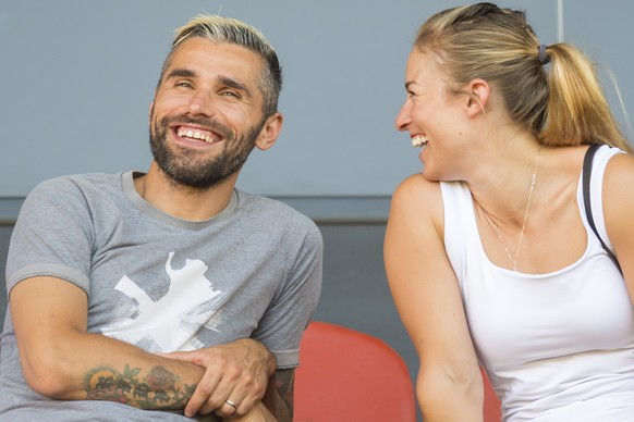 epa07735879 Sion&#039;s soccer player Valon Behrami, left, talks to his wife Lara Gut-Behrami, right, skier from Switzerland during a friendly soccer match between FC Sion from Switzerland and Valenci ...