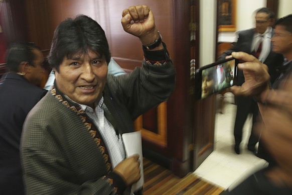 In this Nov. 27, 2019 photo, Bolivia&#039;s former President Evo Morales pumps his fist after a press conference at the journalists club in Mexico City. Morales went into exile in Mexico after he was  ...