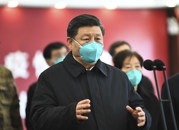 In this photo released by China&#039;s Xinhua News Agency, Chinese President Xi Jinping talks by video with patients and medical workers at the Huoshenshan Hospital in Wuhan in central China&#039;s Hu ...