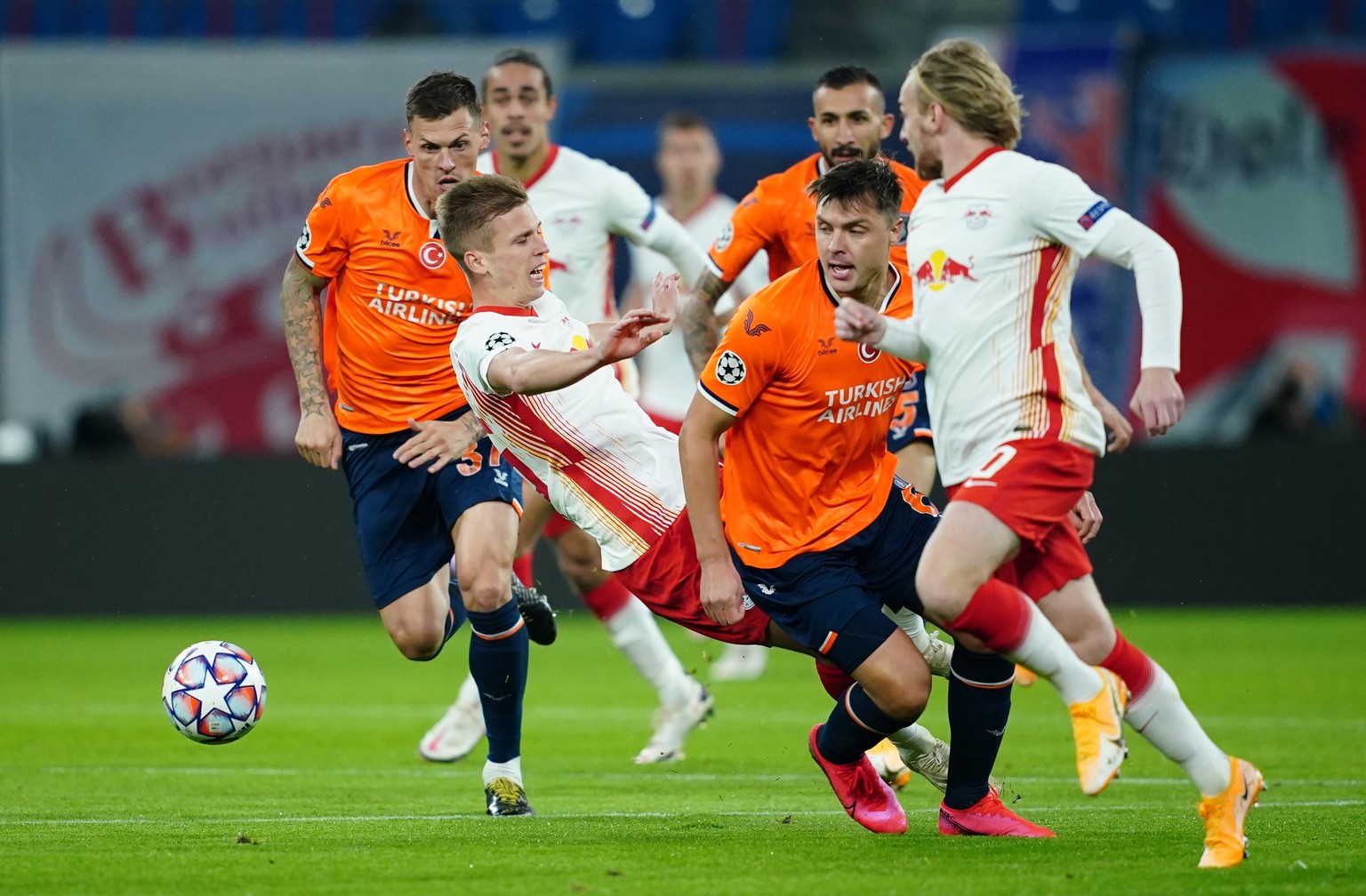 epa08760060 Leipzig&#039;s Dani Olmo (2-L) is being fouled during the UEFA Champions League group stage soccer match between RB Leipzig and Istanbul Basaksehir in Leipzig, Germany, 20 October 2020. EP ...