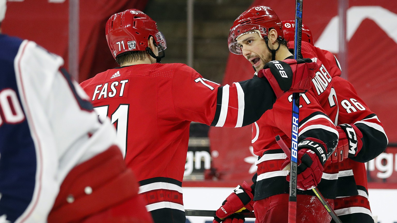 Carolina Hurricanes&#039; Nino Niederreiter (21) celebrates his goal with teammate Teuvo Teravainen (86) and Jesper Fast (71) during the second period of an NHL hockey game against the Columbus Blue J ...