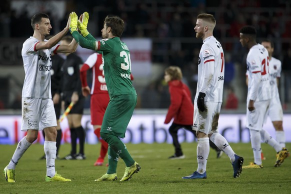 Xamax&#039;s midfielder Samir Ramizi, left, celebrates with goalkeeper Laurent Walthert, 2nd left, after winning against Sion, during the Super League soccer match of Swiss Championship between FC Sio ...