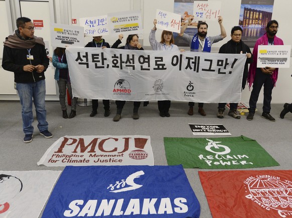 Young people protest in the main hall at the COP24 summit in Katowice, Poland, Thursday, Dec. 13, 2018.(AP Photo/Czarek Sokolowski)
