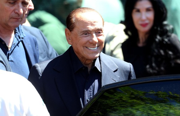 epa07550625 Former Italian Prime Minister Silvio Berlusconi smiles as he leaves San Raffaele Hospital where he underwent laparoscopic surgery for an intestinal obstruction last week, in Milan, Italy,  ...