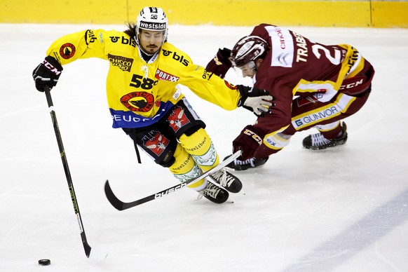 Bern&#039;s defender Eric Blum, left, vies for the puck with Geneve-Servette&#039;s forward Tim Traber, right, during the game of National League A (NLA) Swiss Championship between Geneve-Servette HC  ...
