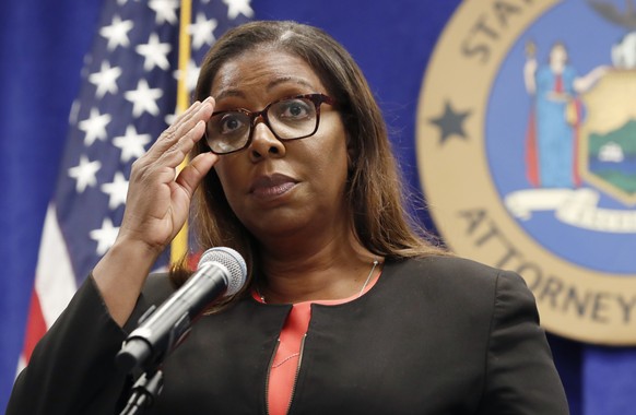 New York State Attorney General Letitia James adjusts her glasses as she announces that the state is suing the National Rifle Association during a press conference, Thursday, Aug. 6, 2020, in New York ...