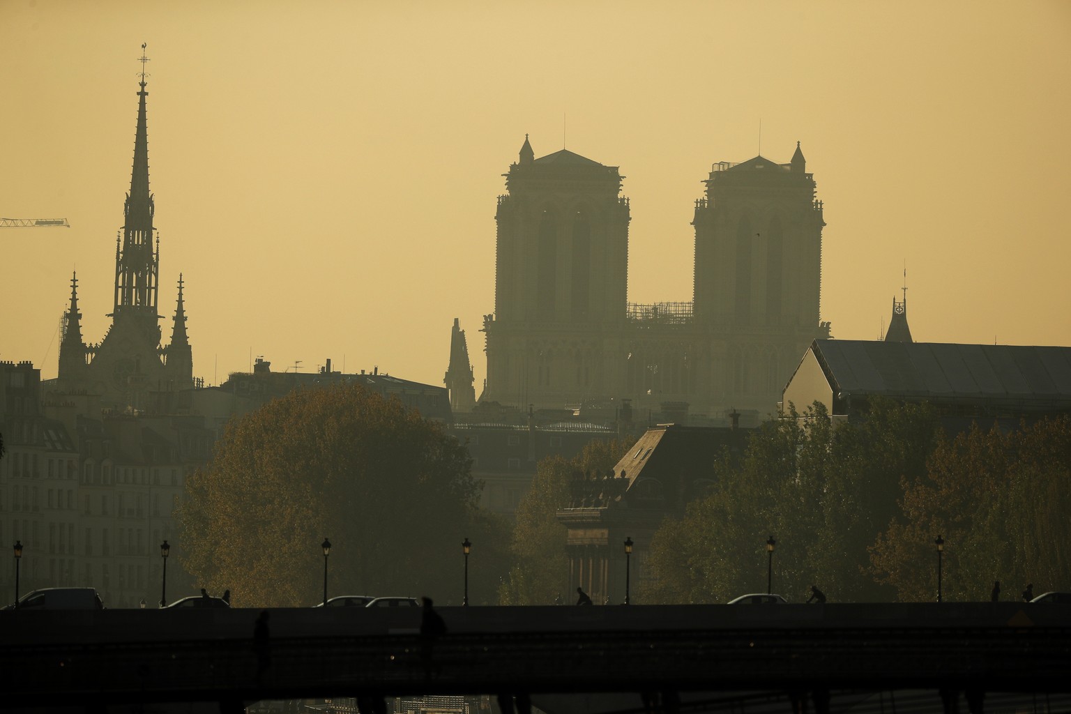 epa07511282 The two main towers of the Notre-Dame Cathedral are silhouetted against the sky in the aftermath of a fire that devastated the cathedral in Paris, France, 17 April 2019. A fire started on  ...