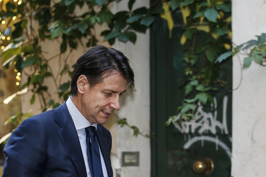 Italian Premier designate Giuseppe Conte arrives at his home in the centre of Rome, Saturday, May 26, 2018. (Fabio Frustaci/ANSA via AP)