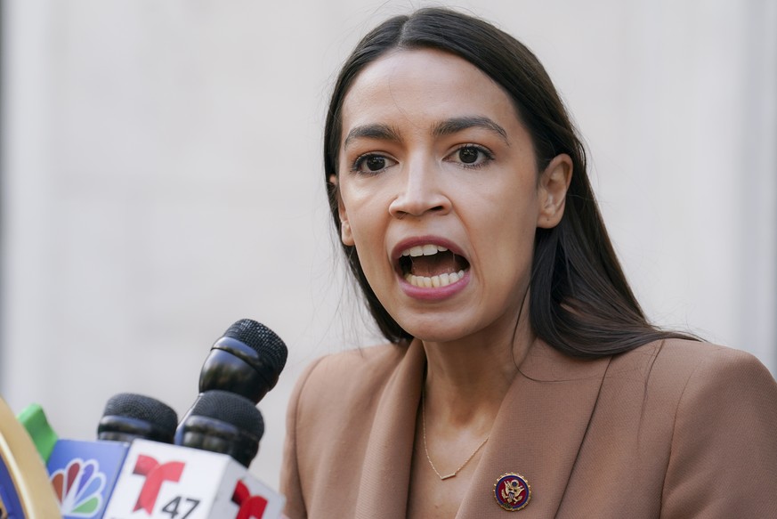 Rep. Alexandria Ocasio-Cortez, D-NY, speaks during a news conference outside the United States Postal Service Jamaica station, Tuesday, Aug. 18, 2020, in the Queens borough of New York. The Postal Ser ...