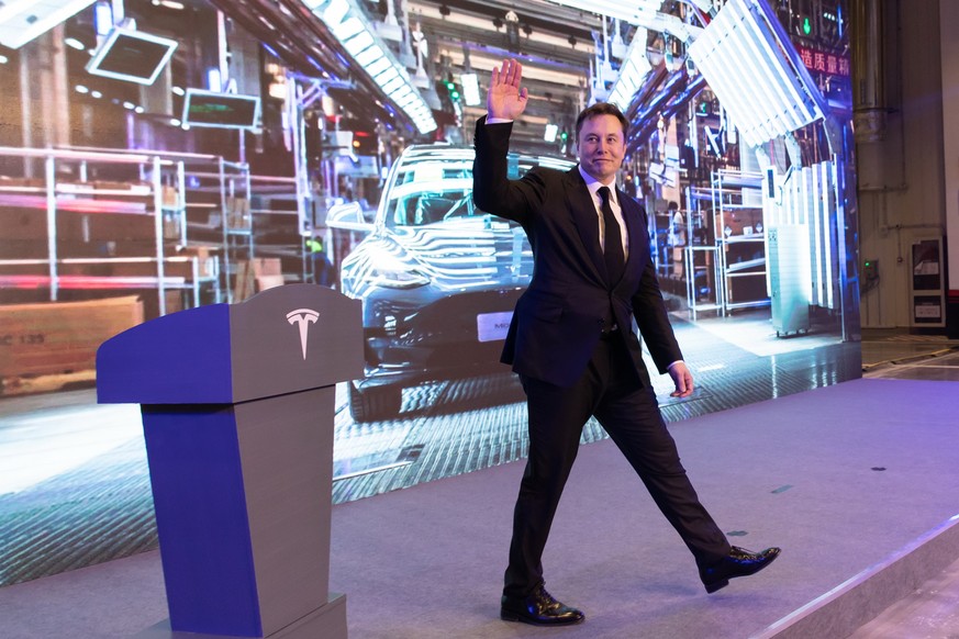 epa08110485 Elon Musk walks off the lectern after a speech at the delivery ceremony of the first batch of Shanghai made Tesla Model 3 sedans in Shanghai, China, 07 January 2020. Ten customers became t ...