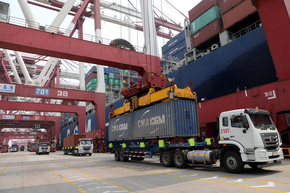epa06866949 (FILE) - Trucks transport containers at the Port of Qingdao in Qingdao, China&#039;s Shandong province, 30 April 2018 (reissued 06 July 2018). According to media reports on 06 July 2018, U ...