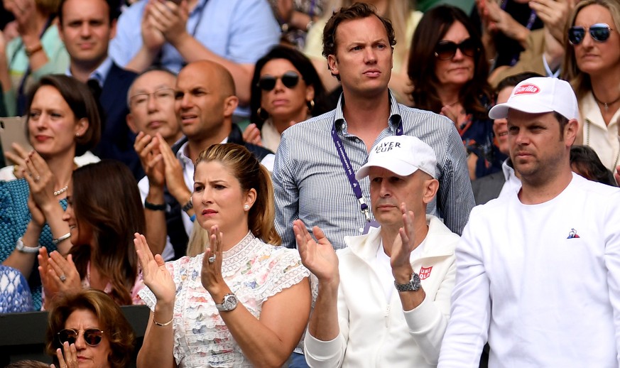 epa07716693 Mirka Federer wife of Roger Federer (C) shows her support in the Men&#039;s Singles final between Roger Federer of Switzerland and Novak Djokovic of Serbia at the Wimbledon Championships a ...