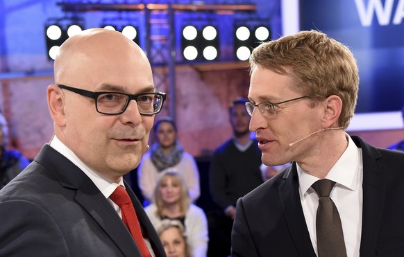 In this April 25, 2017 photo the top candidates of the state election in Schleswig Holstein, Torsten Albig, left, of the Social Democratic party and Daniel Guenther, right, of the Christian Democratic ...