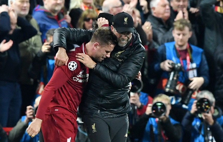 epa07554660 Liverpool manager Juergen Klopp (R) and player Jordan Henderson celebrate after winning the UEFA Champions League semi final 2nd leg match between Liverpool FC and FC Barcelona at Anfield, ...
