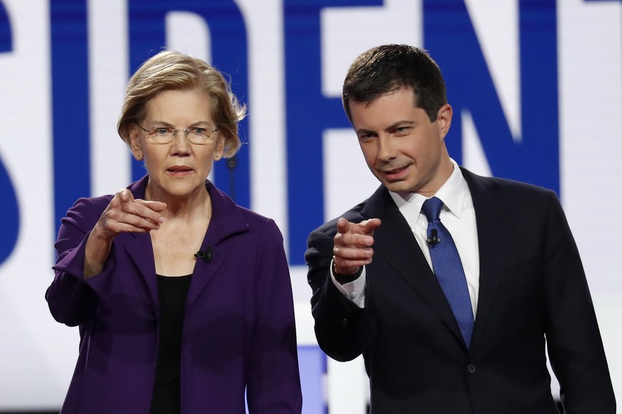 Democratic presidential candidate Sen. Elizabeth Warren, D-Mass., left, and South Bend Mayor Pete Buttigieg stand on stage before a Democratic presidential primary debate hosted by CNN/New York Times  ...