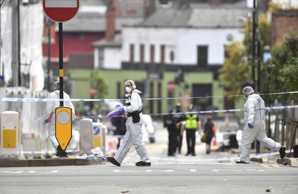 Police forensic officers investigate after stabbings in Birmingham, northern England, Sunday Sept. 6, 2020. Police were called to the scene after a number of people were reported to be stabbed in the  ...
