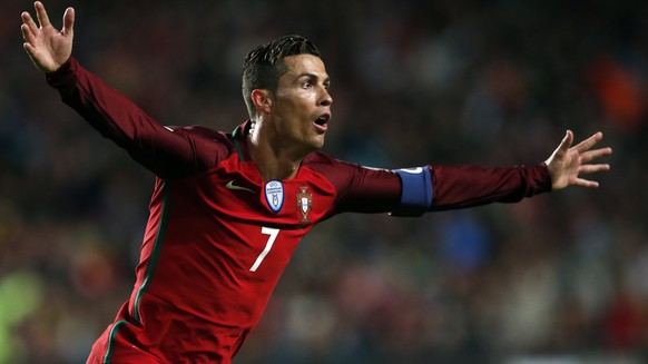epa05870707 Portugal&#039;s player Cristiano Ronaldo celebrates after scoring a goal during their 2018 FIFA World Cup Russia group B qualifying soccer match against Hungary at Luz Stadium in Lisbon, P ...