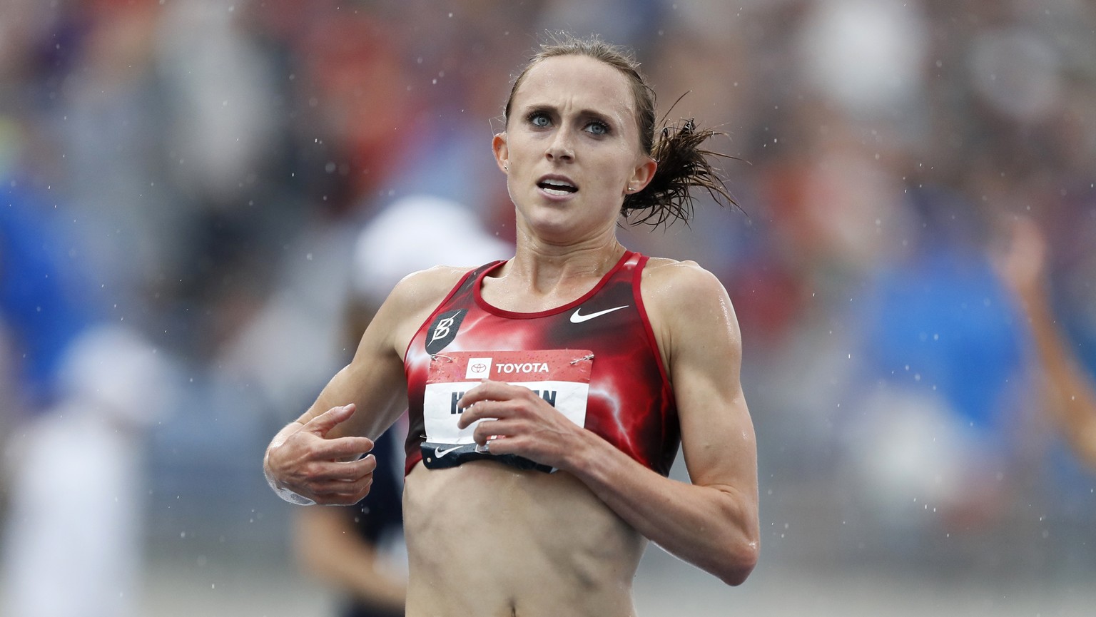 FILE - In this Sunday, July 28, 2019, file photo, Shelby Houlihan crosses the finish line as she wins the women&#039;s 5,000-meter run at the U.S. Championships athletics meet, in Des Moines, Iowa. Ho ...