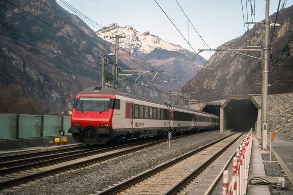 epa05670378 A passenger train enters the south portal of the Gotthard rail tunnel, the longest tunnel in the world, between Erstfeld and Pollegio, in Pollegio, Switzerland, 11 December 2016. The const ...