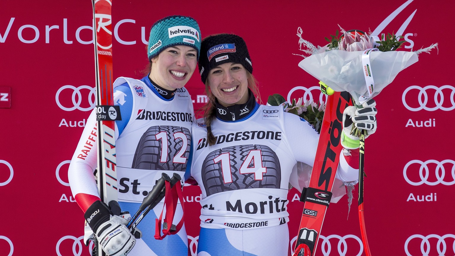 epa06378620 Jasmine Flury, of Switzerland, right, first place, and Michelle Gisin, left, of Switzerland, second place, celebrate on the podium in the finish area at the women&#039;s Super-G race at th ...