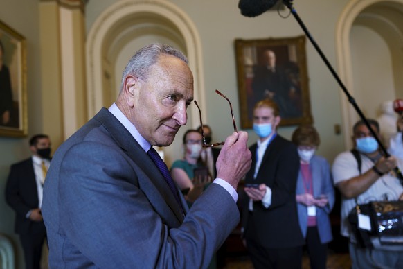 Senate Majority Leader Chuck Schumer, D-N.Y., updates reporters on the latest action in the infrastructure negotiations between Republicans and Democrats, at the Capitol in Washington, Wednesday, July ...